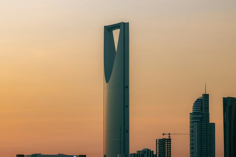 Kingdom Centre tower in Riyadh against an orange sky
